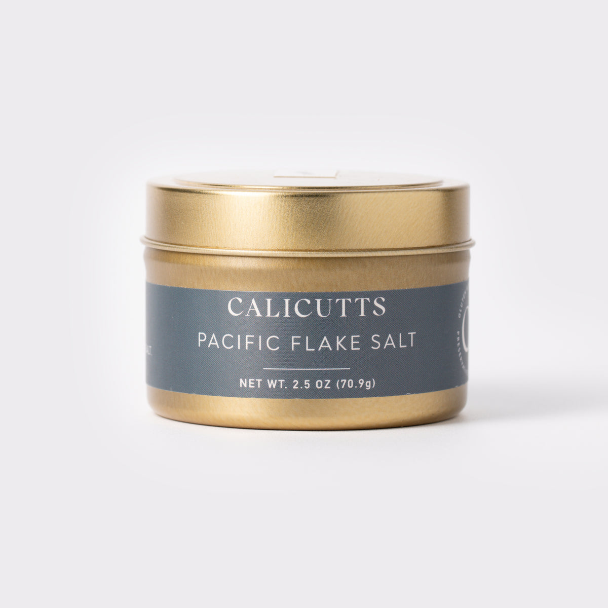 a gold container with a blue label