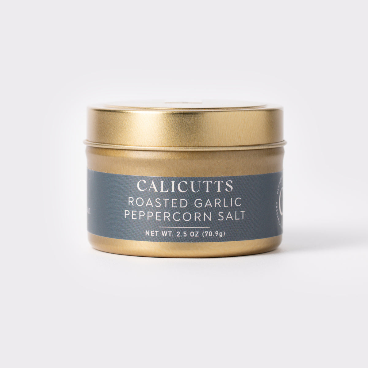 a gold container with a blue label